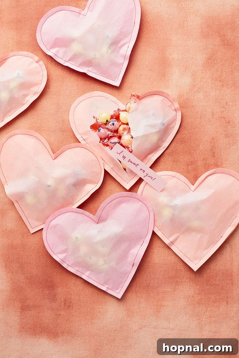 Heartfelt Creations: 14 DIY Valentine's Day Projects 8 Delightful stuffed paper hearts made from orange tissue paper and white parchment, filled with candy, captured by LENNART WEIBULL.