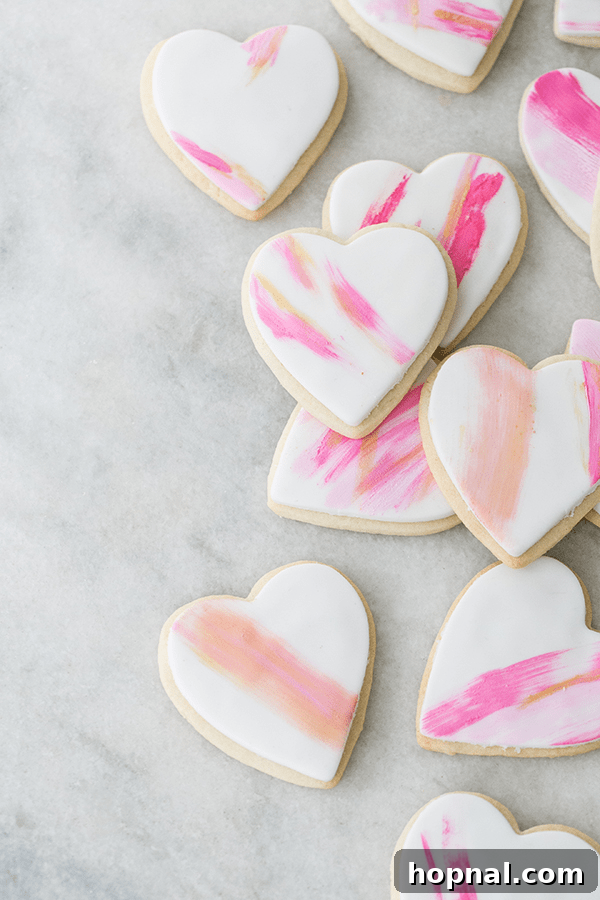 Heartfelt Creations: 14 DIY Valentine's Day Projects 9 Artistically brush-stroked heart-shaped sugar cookies, beautifully decorated for Valentine's Day.