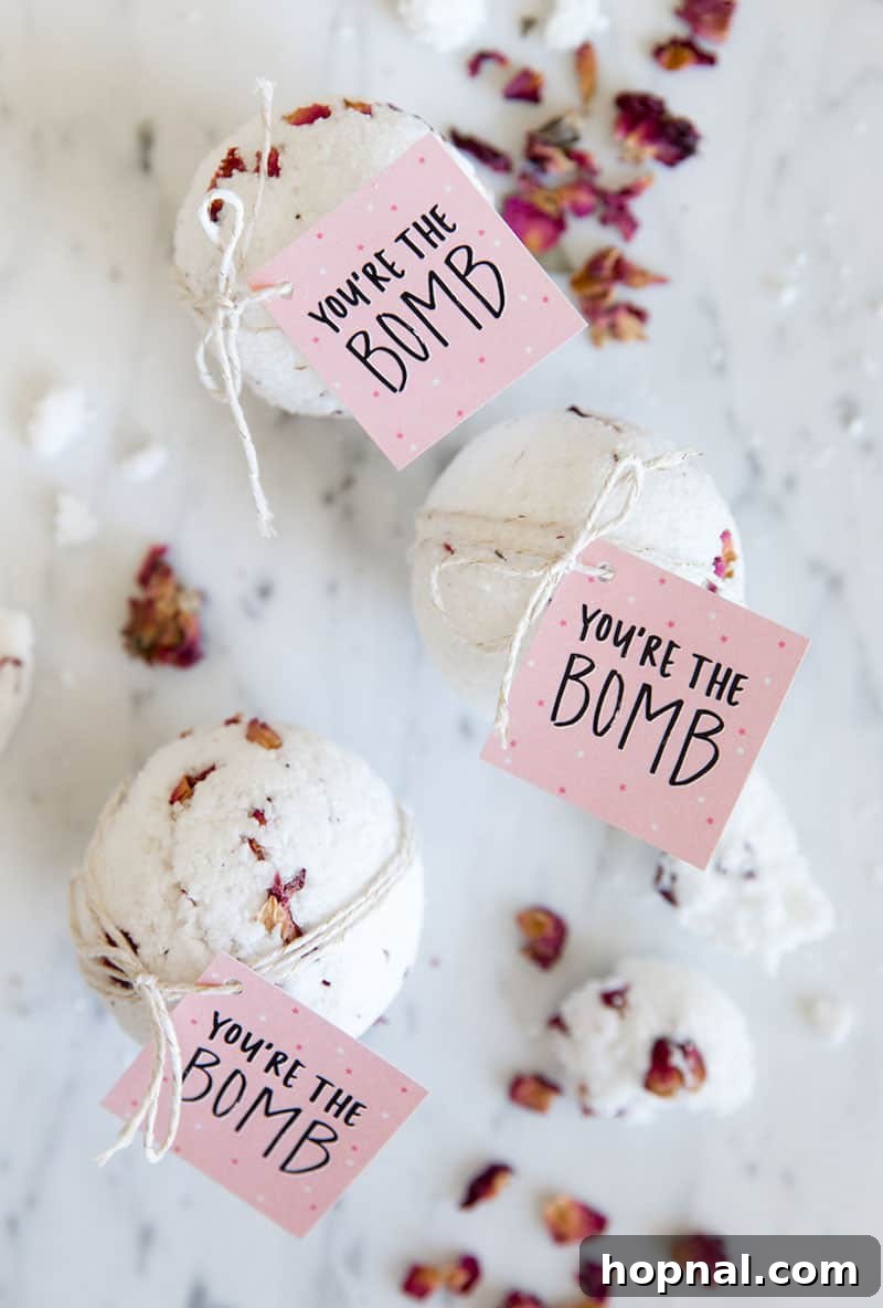 Heartfelt Creations: 14 DIY Valentine's Day Projects 10 Luxurious Valentine's Day bath bombs adorned with dried flowers, accompanied by a 'You're the Bomb' printable label.