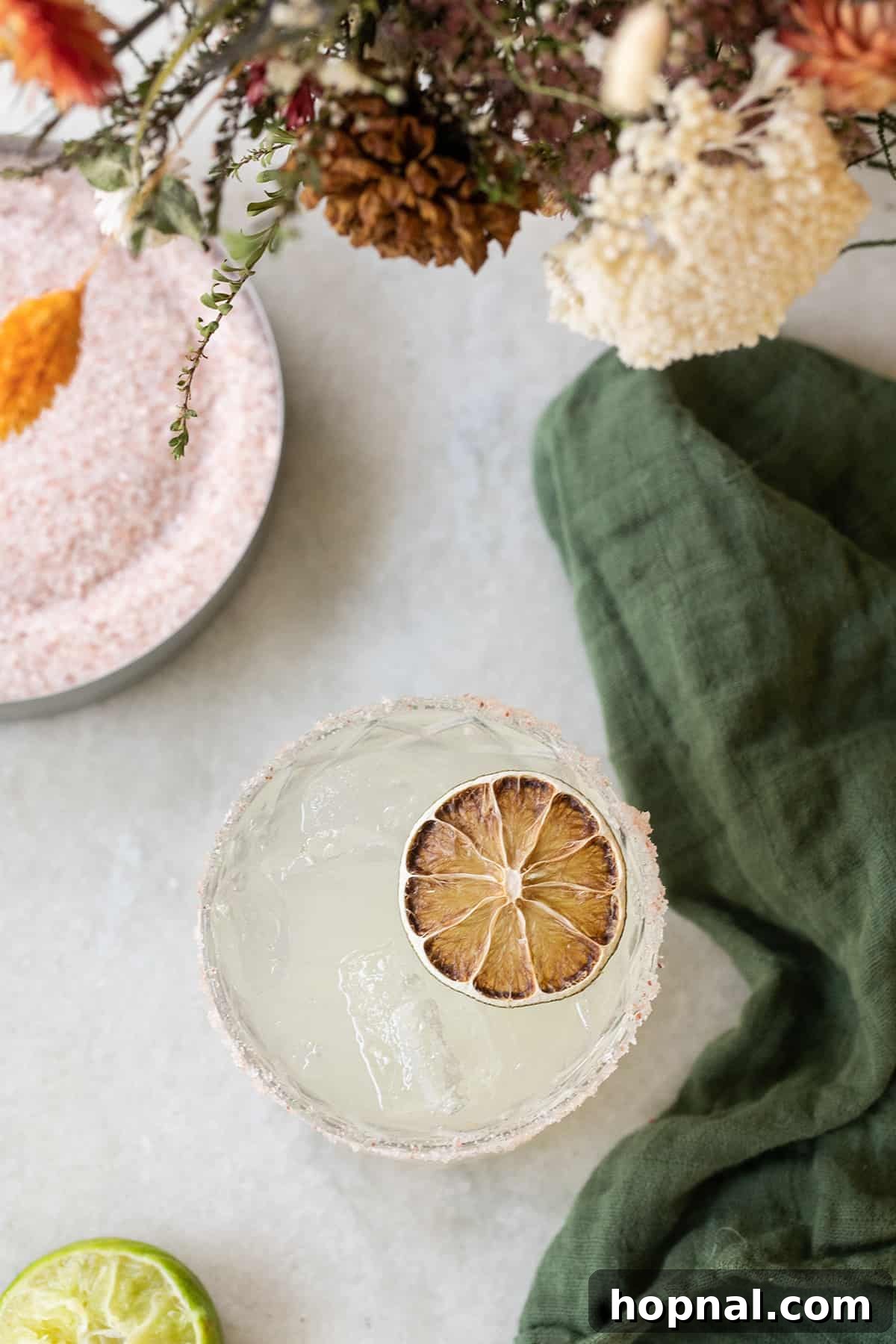 Margarita mocktail with a lime wheel, a delicious non-alcoholic option.