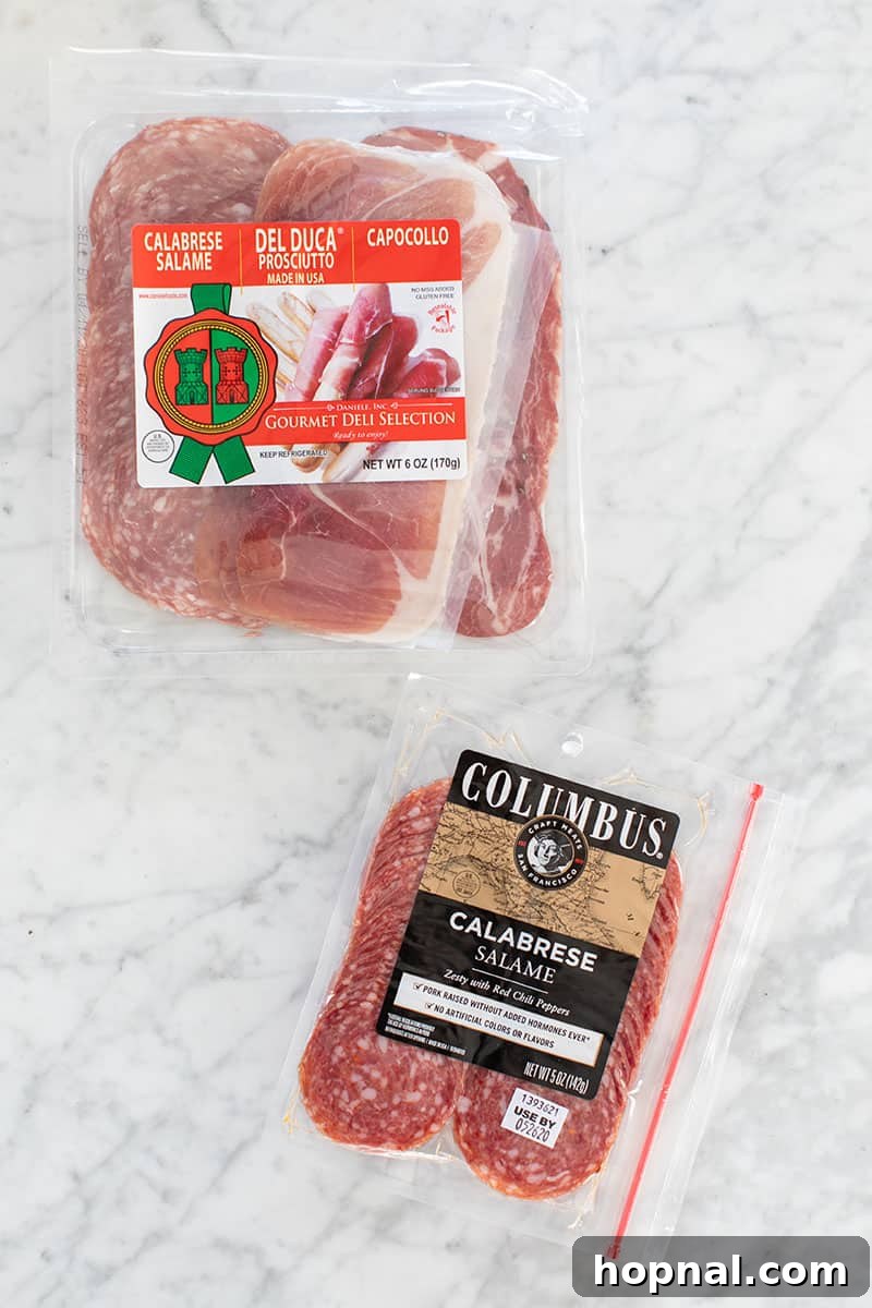 Valentine's Day Sweetheart's Grazing Board 12 An appetizing selection of cured meats, artfully arranged and ready to be part of a gourmet charcuterie platter, promising rich flavors and textures.