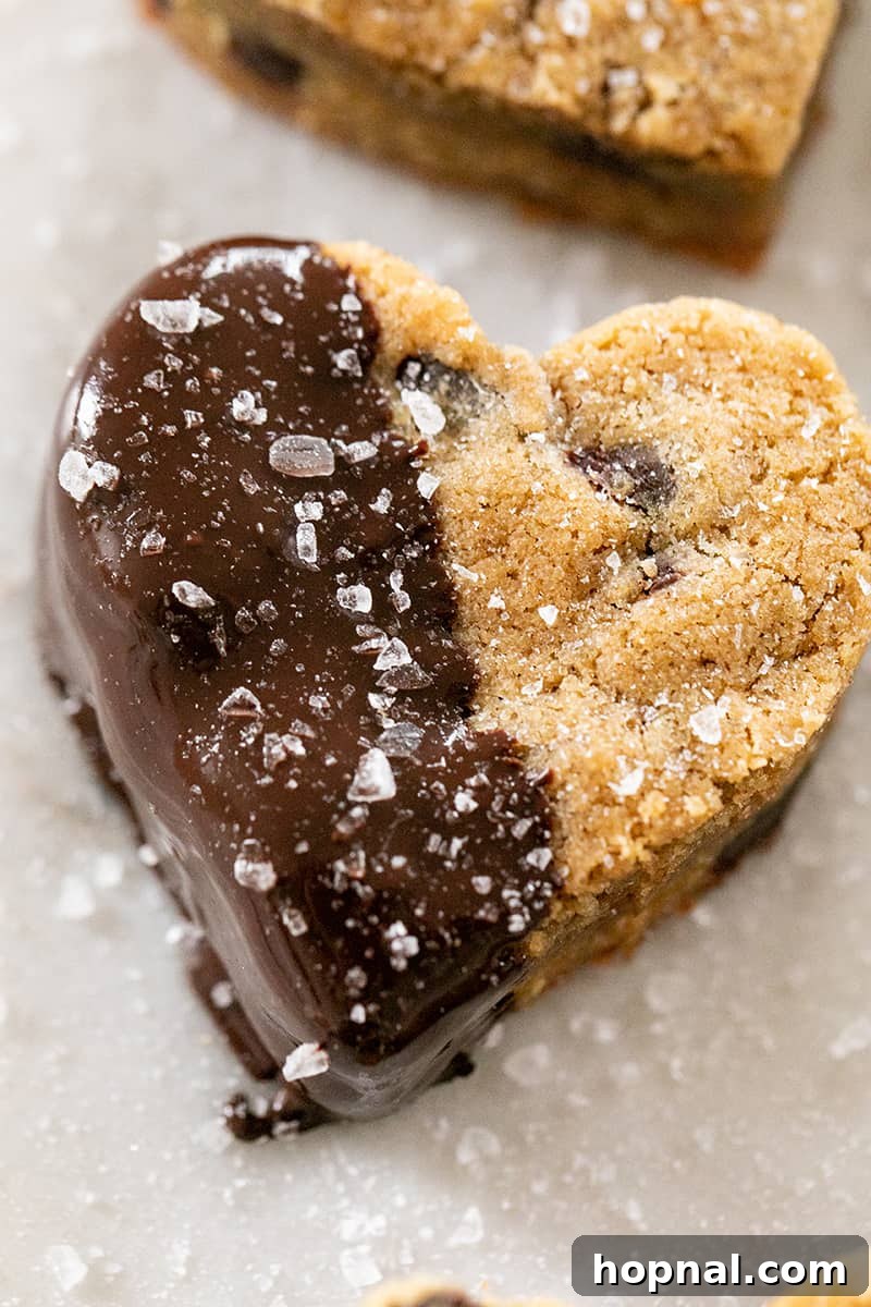 Your Secret to Irresistible Blondies 2 Heart shaped blondie dipped in chocolate with sea salt - dark brown sugar, parchment paper