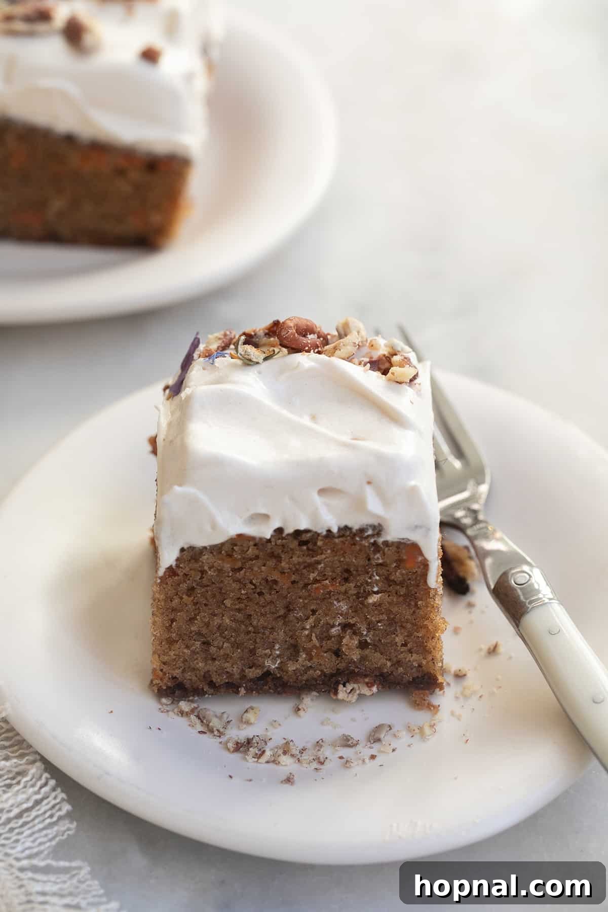 25 Heavenly Homemade Cake Creations 12 Simple carrot cake slice with whipped maple frosting, a delicious snack cake.