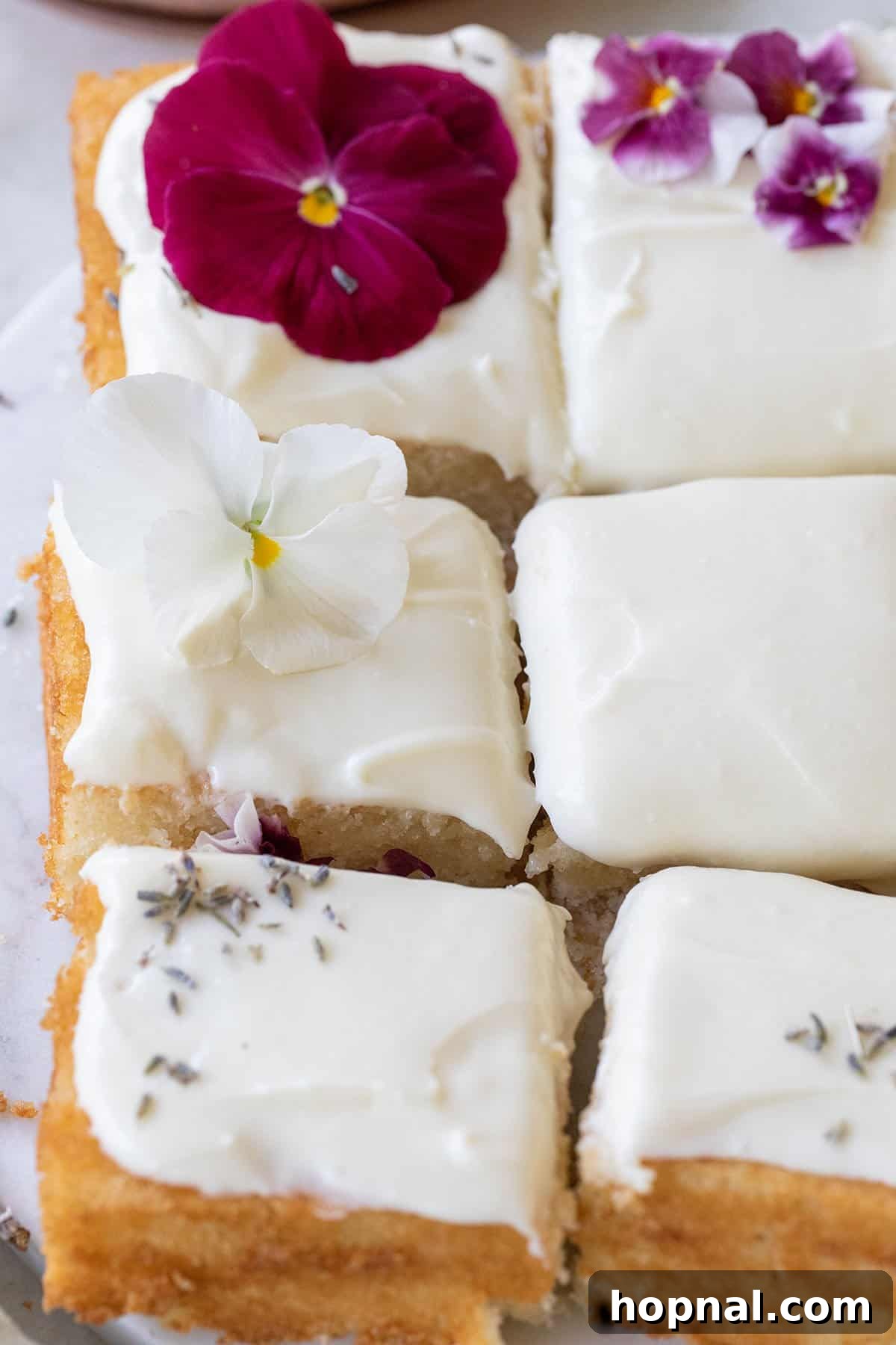 25 Heavenly Homemade Cake Creations 13 Lavender cake recipe adorned with delicate flowers, perfect for spring and summer.