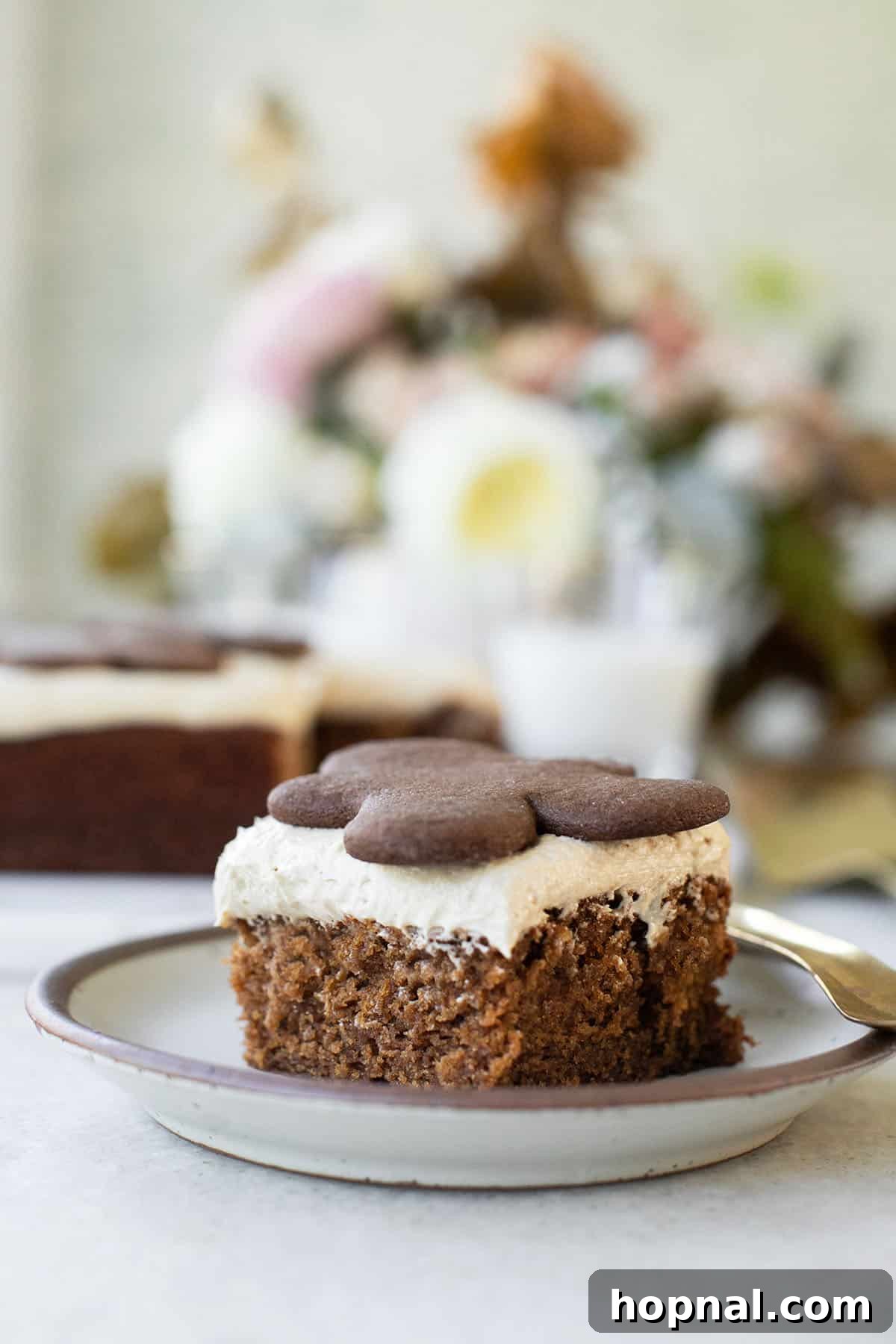 25 Heavenly Homemade Cake Creations 17 Easy gingerbread cake sliced with a gingerbread cookie, a perfect holiday option.