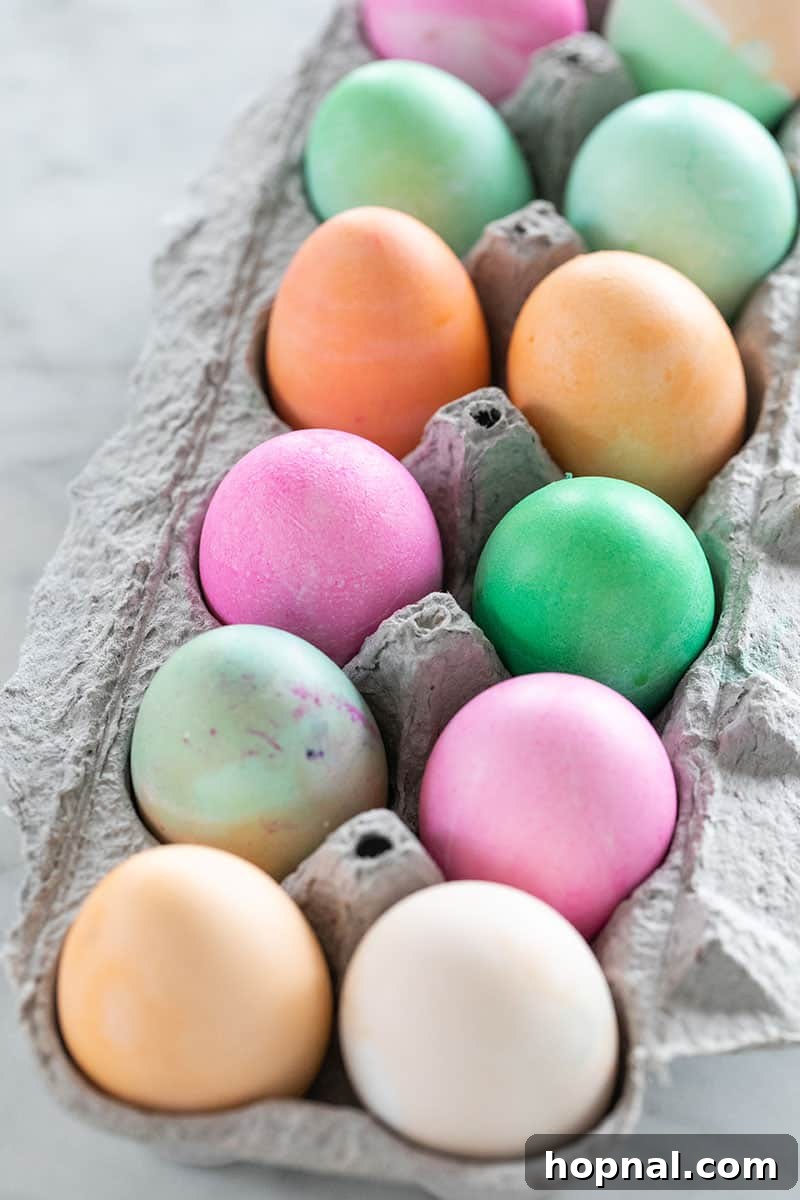 Mastering Easter Egg Dyeing and Design 11 Colored easter eggs in an an egg carton