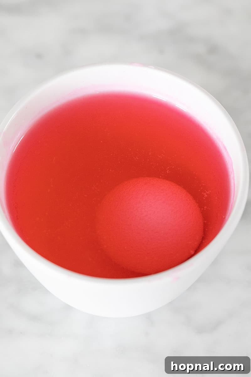 Mastering Easter Egg Dyeing and Design 9 Egg in pink dye.