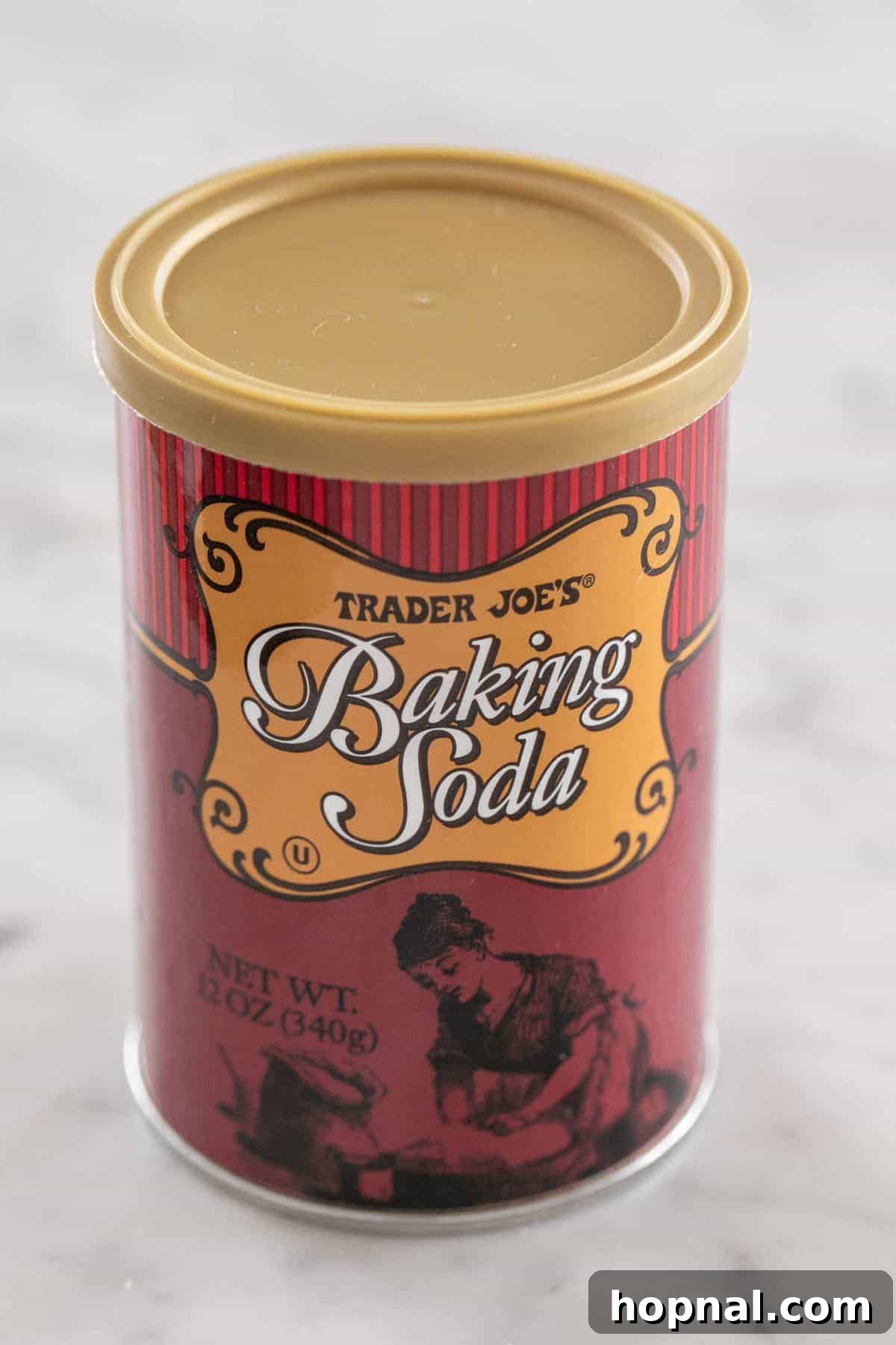 A container of Trader Joe's Baking Soda on a kitchen counter.