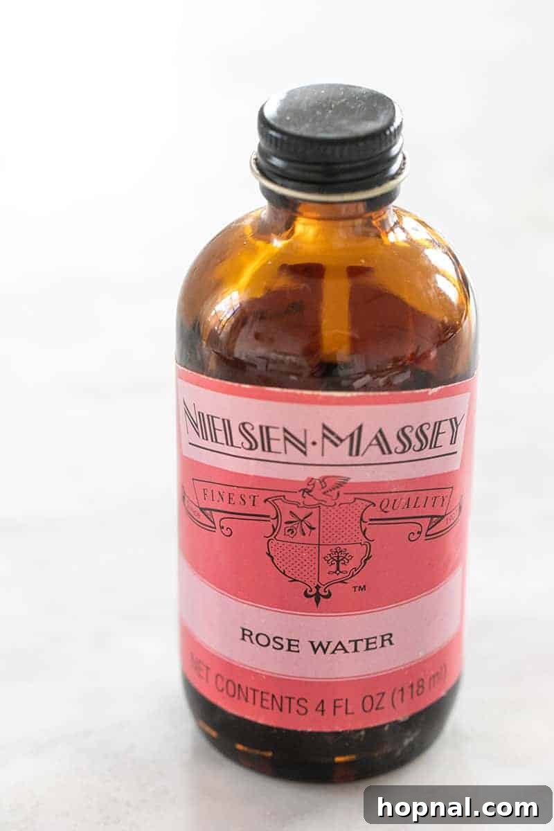 Rose Petal Clouds 11 Rose water extract in a brown jar with a pink label.
