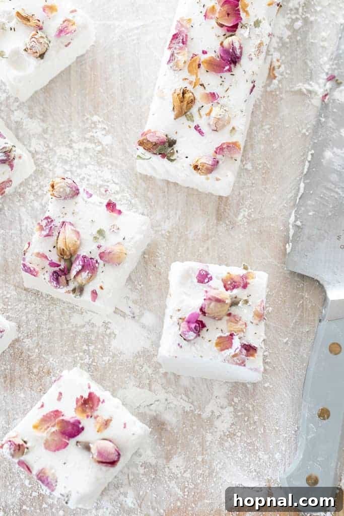 Rose Petal Clouds 17 Dusting cut marshmallows with powdered sugar.