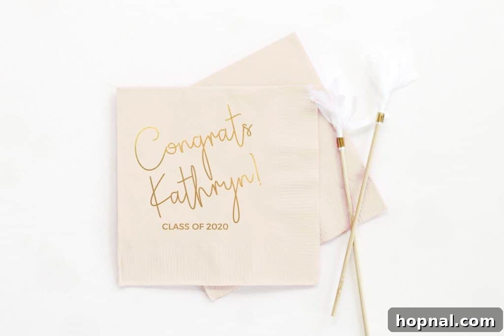 A festive table setting for a graduation party, featuring 'GRAD' letter balloons and celebratory decor.