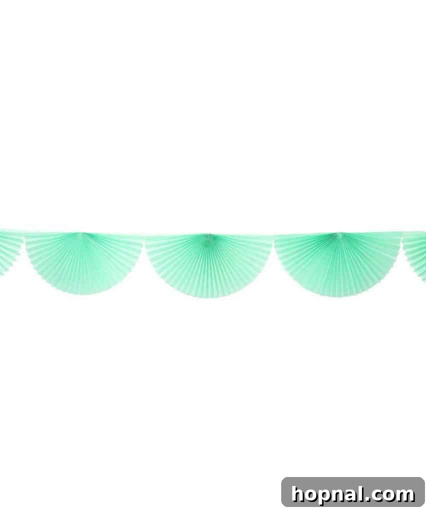 Stylish party decorations featuring 'GRAD' balloons and a confetti background, ideal for high school or college graduation parties.