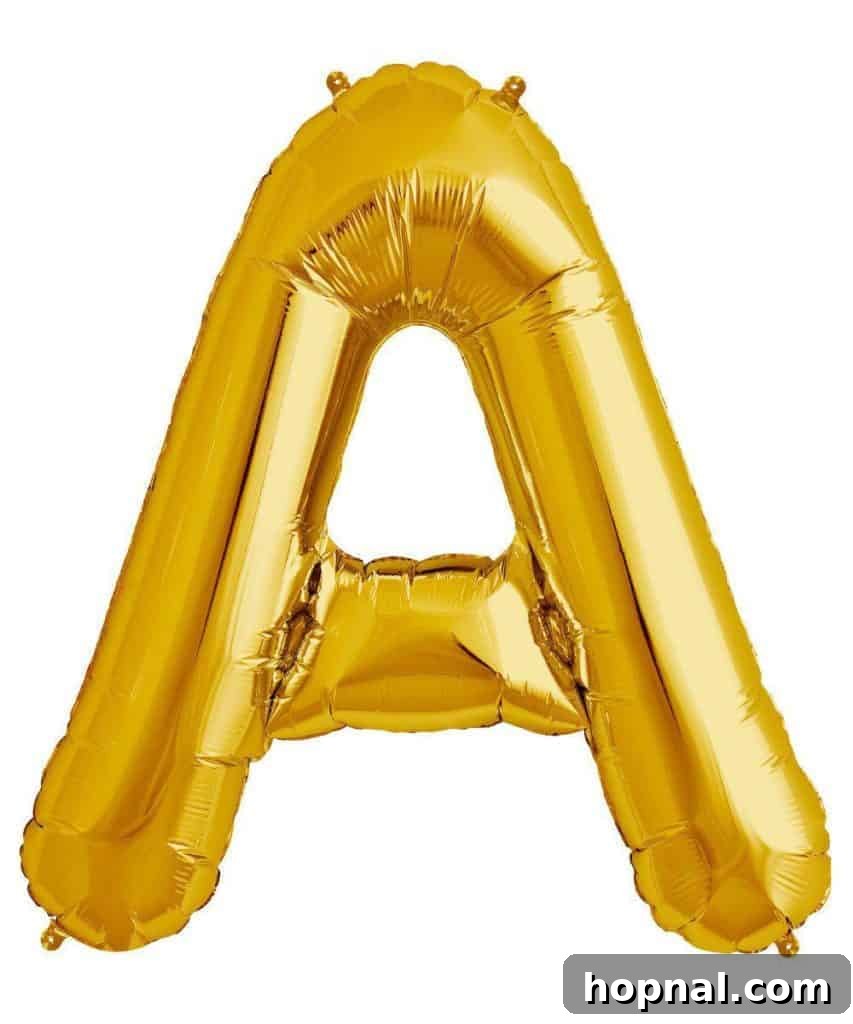 Close-up of a 'GRAD' letter balloon, a popular decoration for graduation parties.