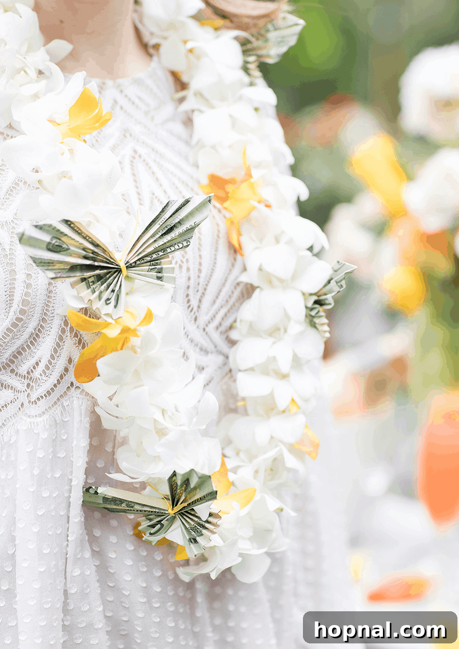 A graduate wearing a beautiful DIY butterfly money lei adorned with delicate flowers and carefully folded money butterflies.