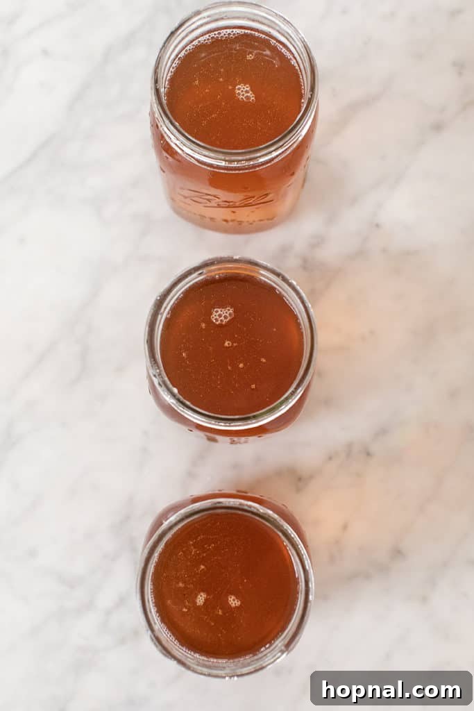Stirring the Everclear into the moonshine base to ensure even distribution.