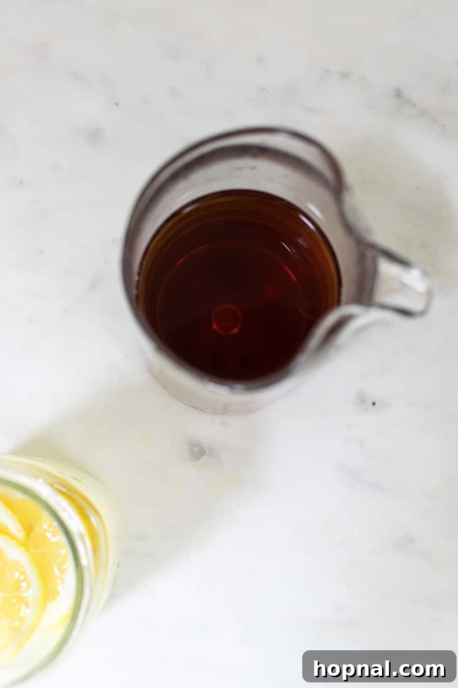 Craft Your Perfect Arnold Palmer 3 Iced tea in a pitcher, ready for mixing