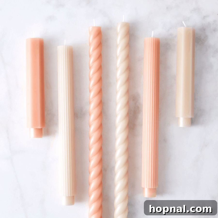 Hygge Your Home, Hygge Your Life 11 A set of tall, fancy taper candles in various elegant colors, enhancing a hygge setting.