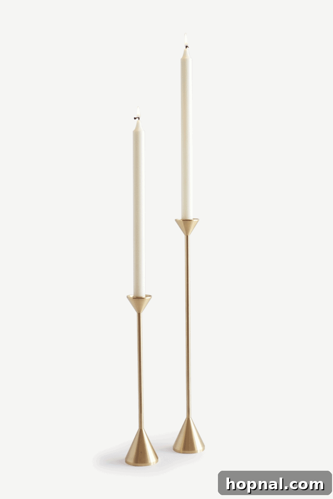 Hygge Your Home, Hygge Your Life 15 A minimalist brass candle holder in a cone shape, ideal for modern hygge decor.