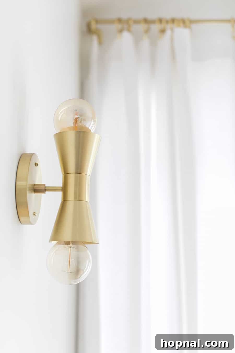 Hygge Your Home, Hygge Your Life 20 A stylish brass light fixture from Cedar and Moss casting a warm glow, illustrating how intentional lighting achieves a perfect hygge ambiance in a home.