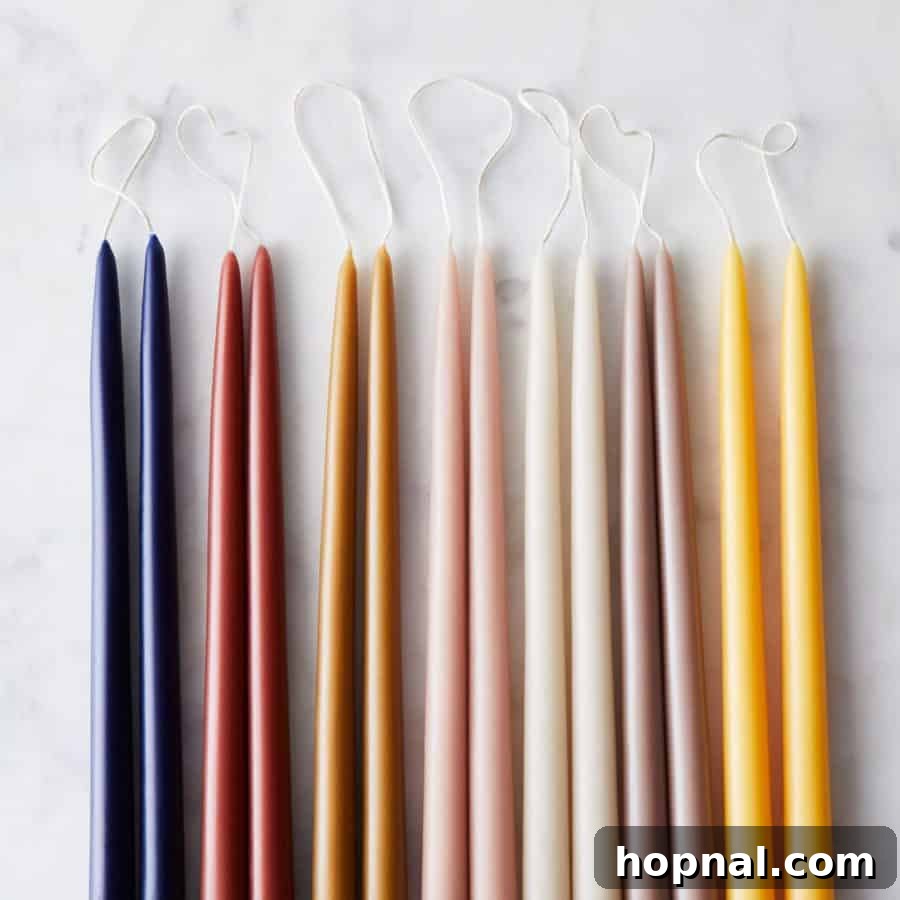 Hygge Your Home, Hygge Your Life 3 Close-up of elegant taper candles from Food52, illuminating a space with a warm, inviting glow—a quintessential hygge element.