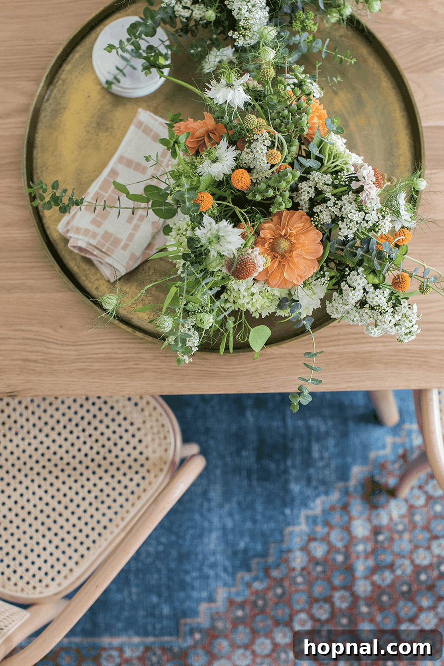 Hygge Your Home, Hygge Your Life 21 A stunning arrangement of fresh flowers on a table, enhancing the simple elegance and comforting ambiance of a hygge-inspired interior.
