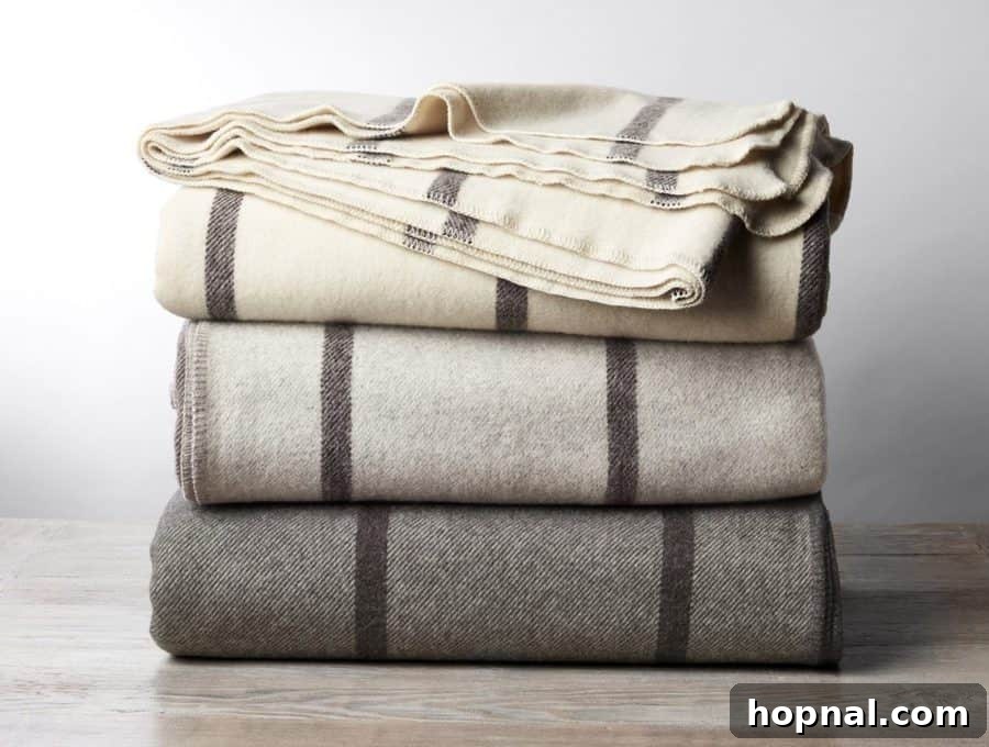 Hygge Your Home, Hygge Your Life 4 A pile of soft, cozy blankets in neutral tones, perfect for snuggling.