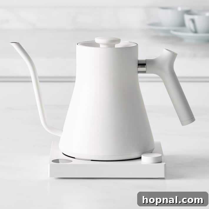 Hygge Your Home, Hygge Your Life 5 A stylish, traditional tea kettle warming on a stovetop, ready for a comforting brew.