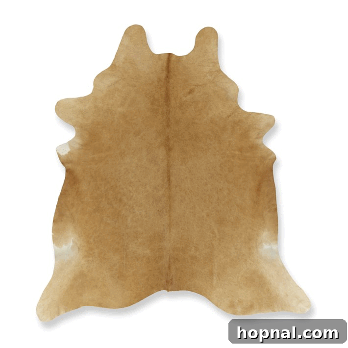 Hygge Your Home, Hygge Your Life 7 A luxurious hide rug laid on a wooden floor, offering texture and warmth.