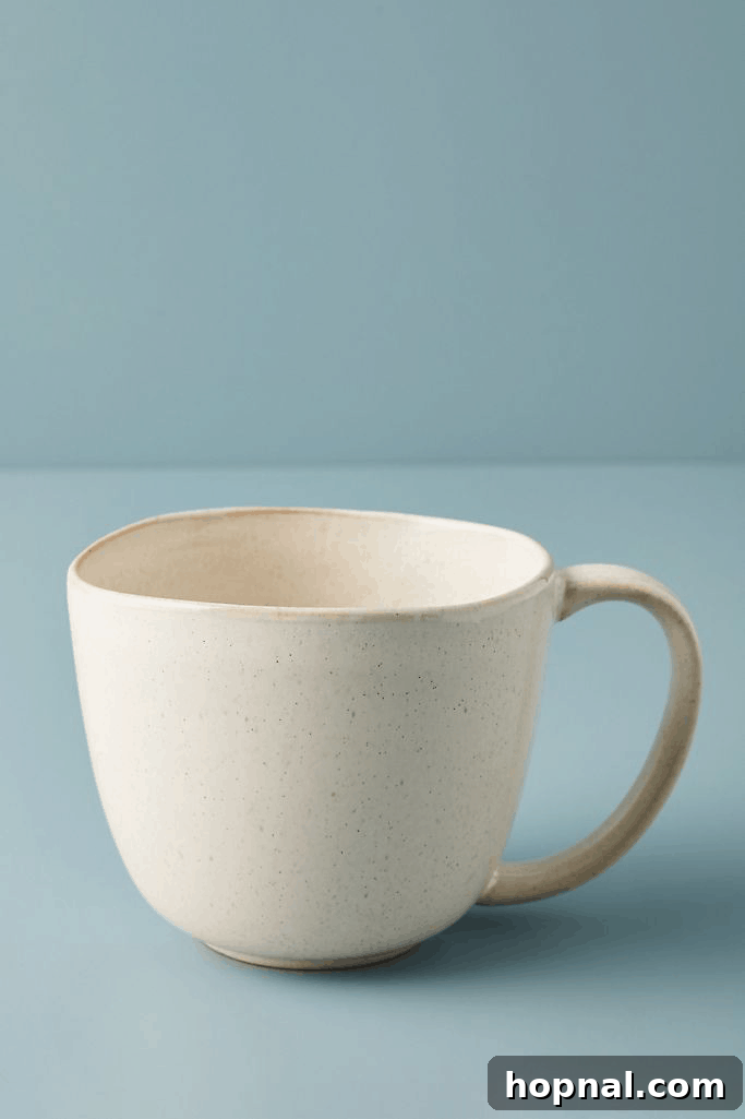 Hygge Your Home, Hygge Your Life 8 A collection of ceramic mugs with comfortable handles, perfect for warm beverages.