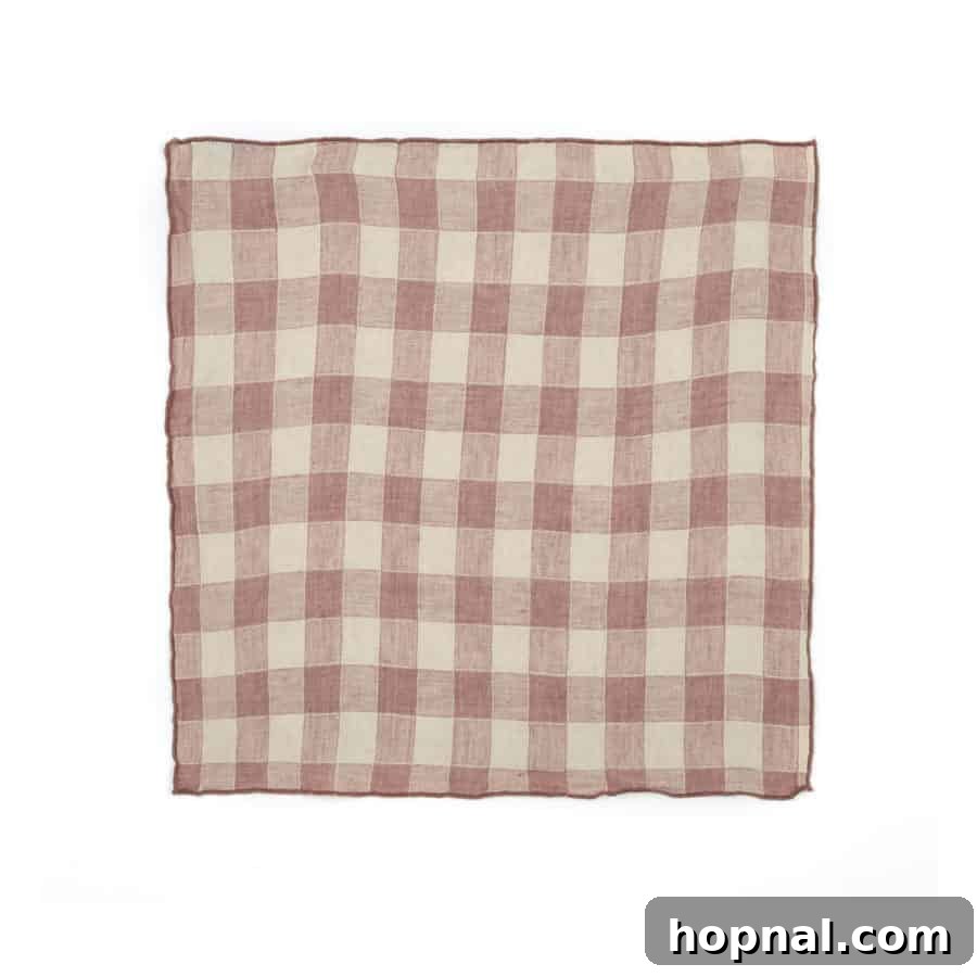 Hygge Your Home, Hygge Your Life 9 A stack of neatly folded linen cloth napkins, ready for a relaxed meal.