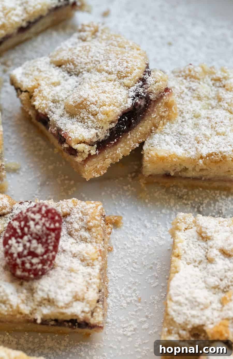 Buttery Shortbread Bars 2 Buttery shortbread cookie crumble bars with luscious raspberry preserves filling and a golden crumbly top.