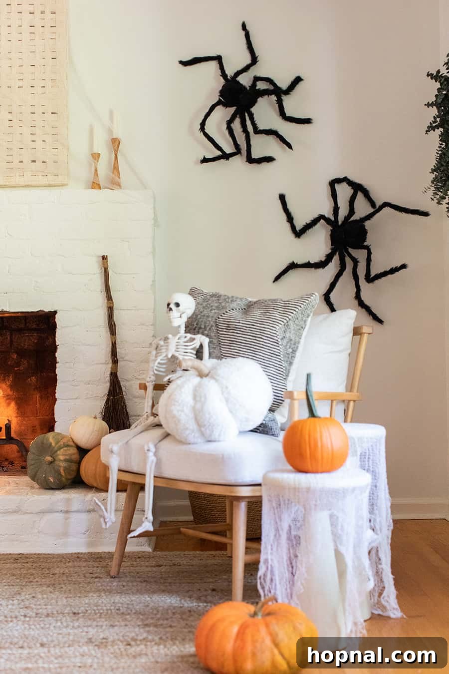 Halloween pumpkin, fireplace with skull and spider web decorations
