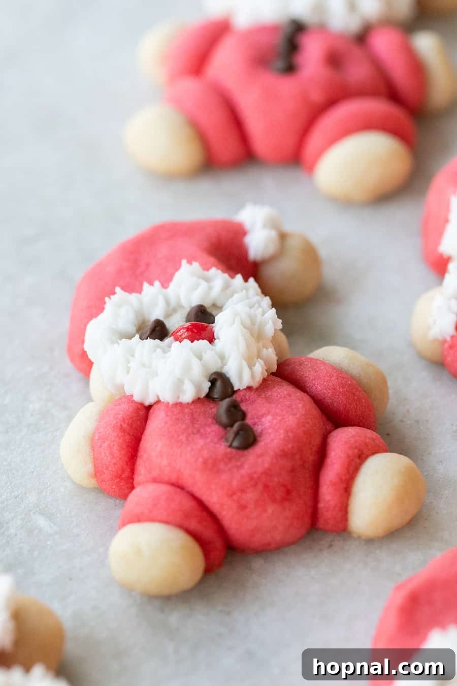 Christmas cookie shaped like Roly-Poly Santa with a frosted beard