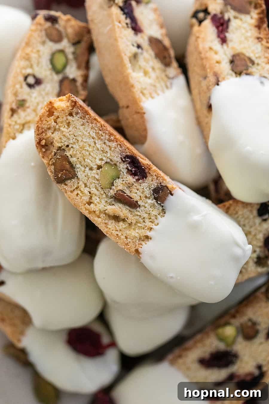 Biscotti Christmas cookies with cranberries and pistachios, dipped in white chocolate