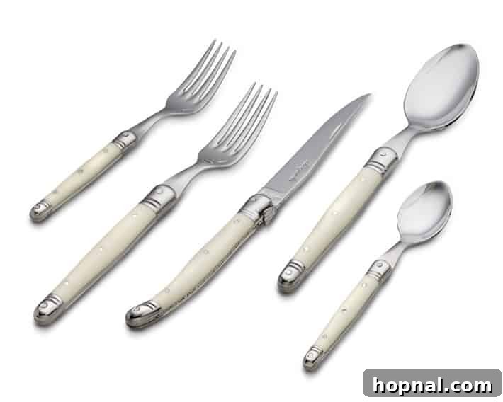 Sparkling Christmas Tablescapes 15 Elegant flatware arranged neatly on a festive Christmas table setting.