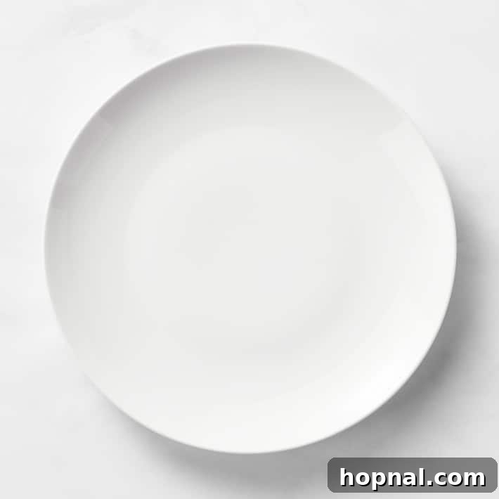 Sparkling Christmas Tablescapes 16 Classic white plates from Williams Sonoma, ready for a festive Christmas meal.
