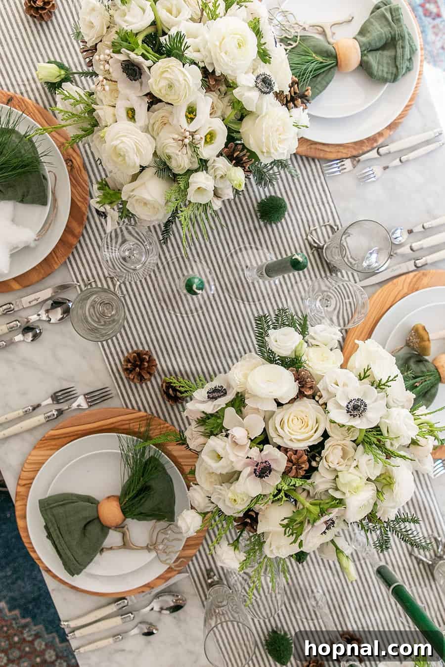Sparkling Christmas Tablescapes 21 Exquisite Christmas table decorations featuring elegant flowers, glowing candles, and natural pine cones, creating a perfect festive setting.