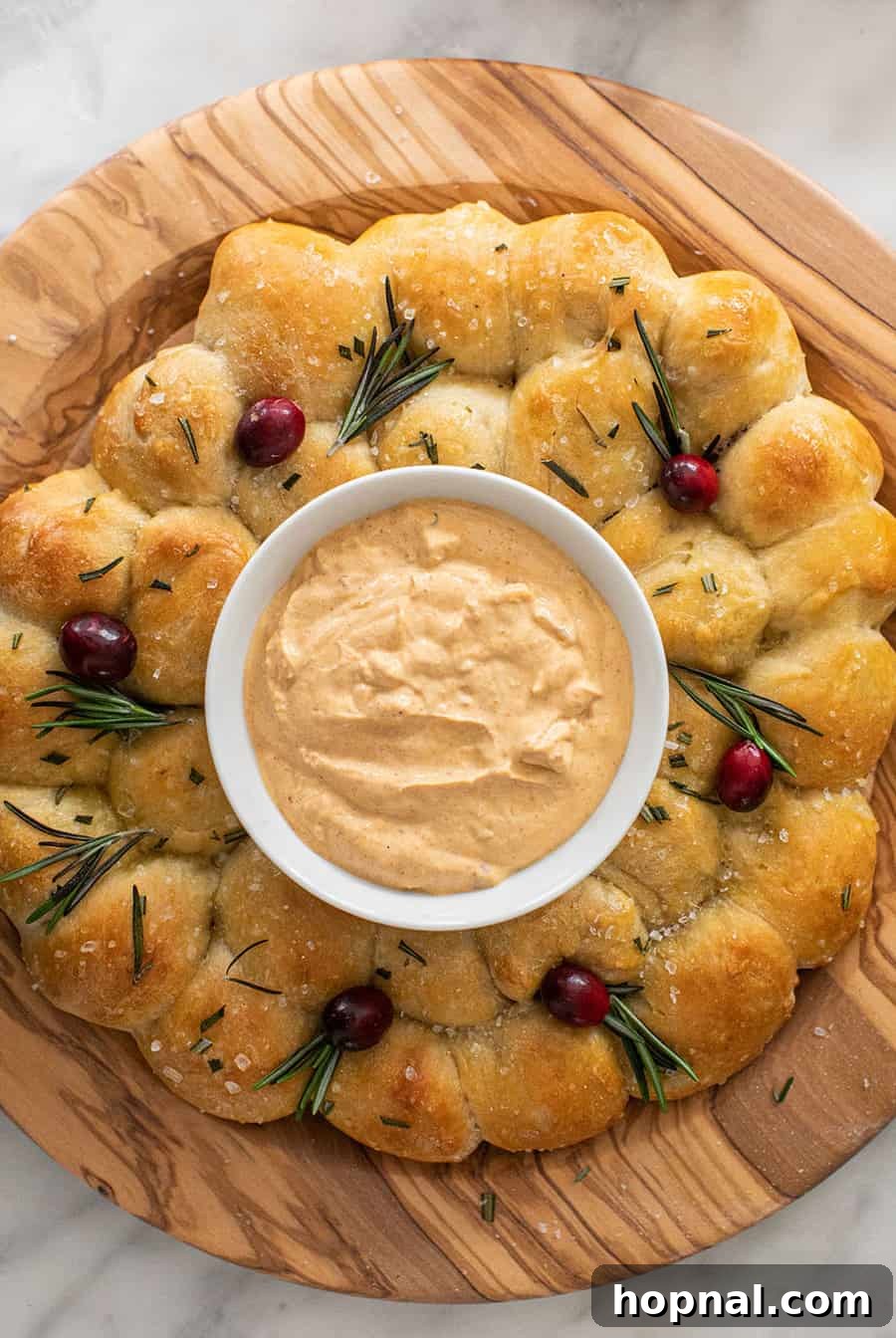 Christmas bread wreath with cheese dip.