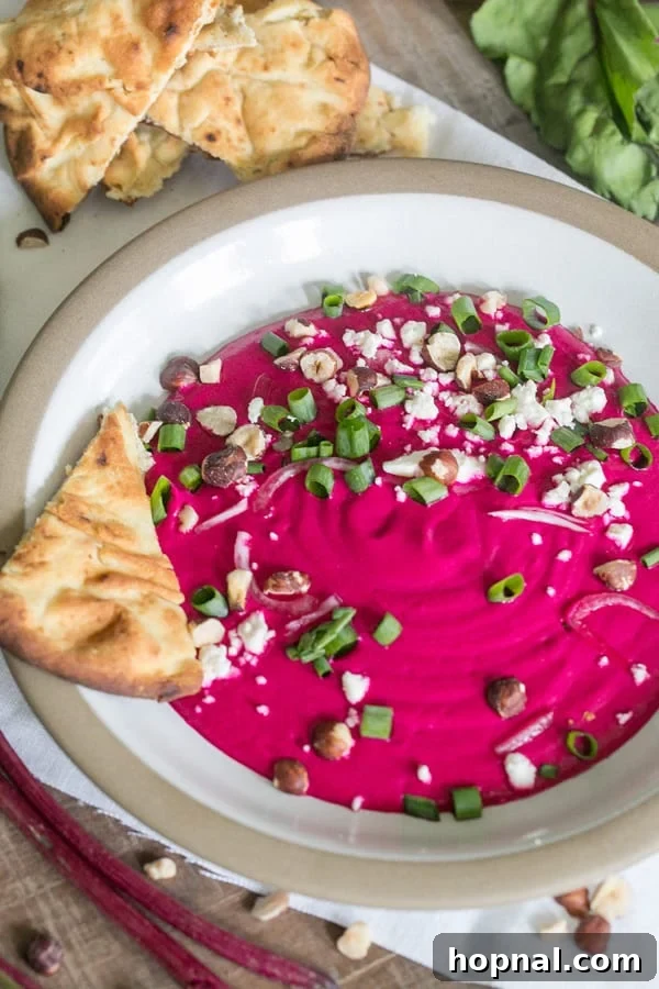 The Ultimate Beet Dip 2 Vibrant beet dip in a bowl, served with toasted pita bread