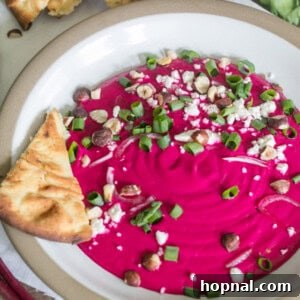 Close-up of pink beet dip, garnished