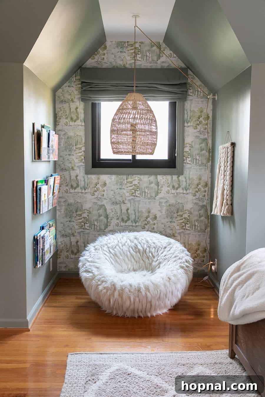 Cozy reading nook in a woodsy kids bedroom with a Pottery Barn swivel chair and soft lighting, perfectly reflecting cabin charm and nature-inspired design.