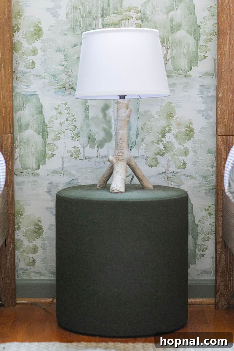 A charming birch lamp from Pottery Barn Kids adds a natural, woodsy touch to a cozy kids bedroom design.