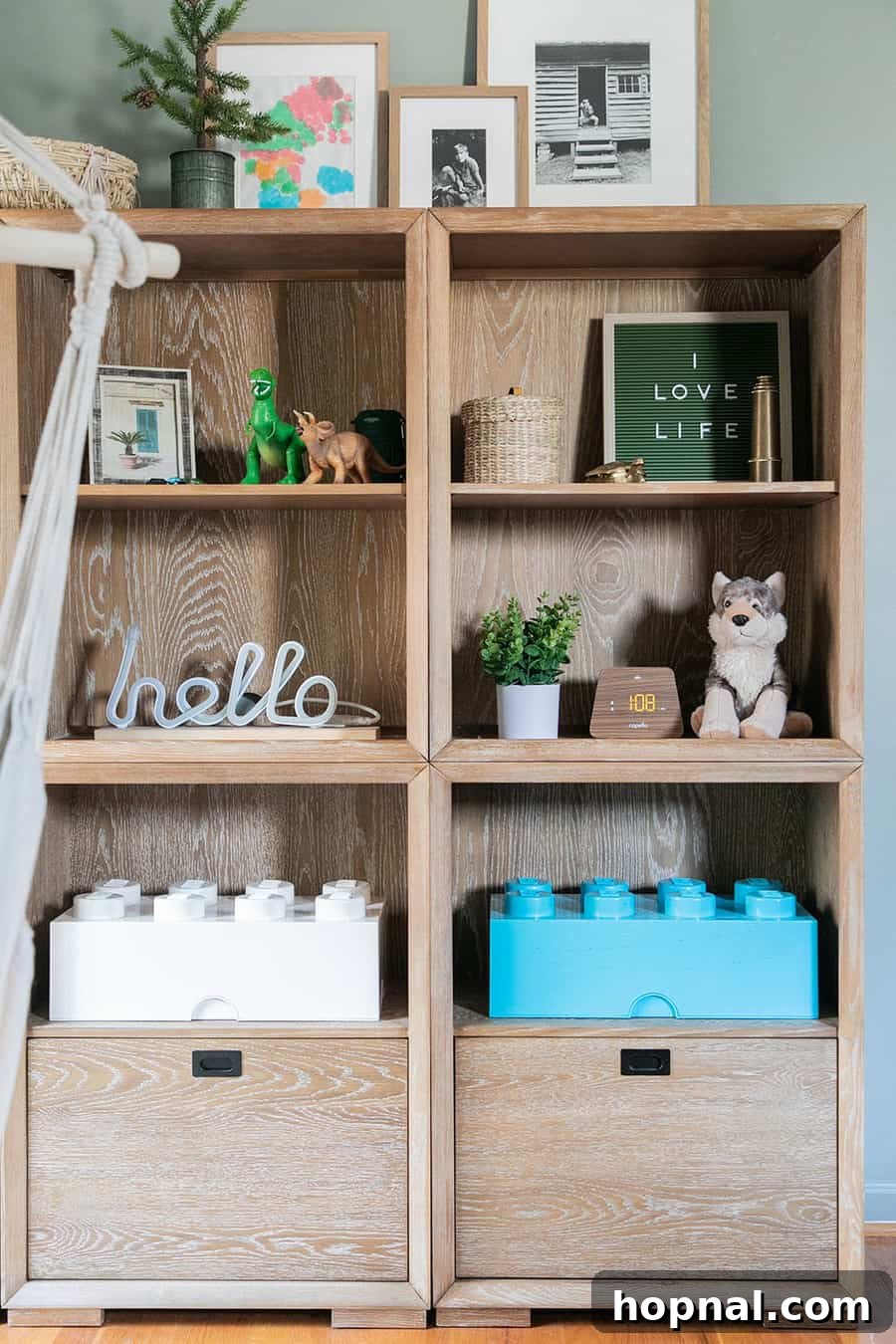 A book shelf adorned with colorful Lego blocks in a kids' room, demonstrating smart storage and playful decor within a woodsy design.