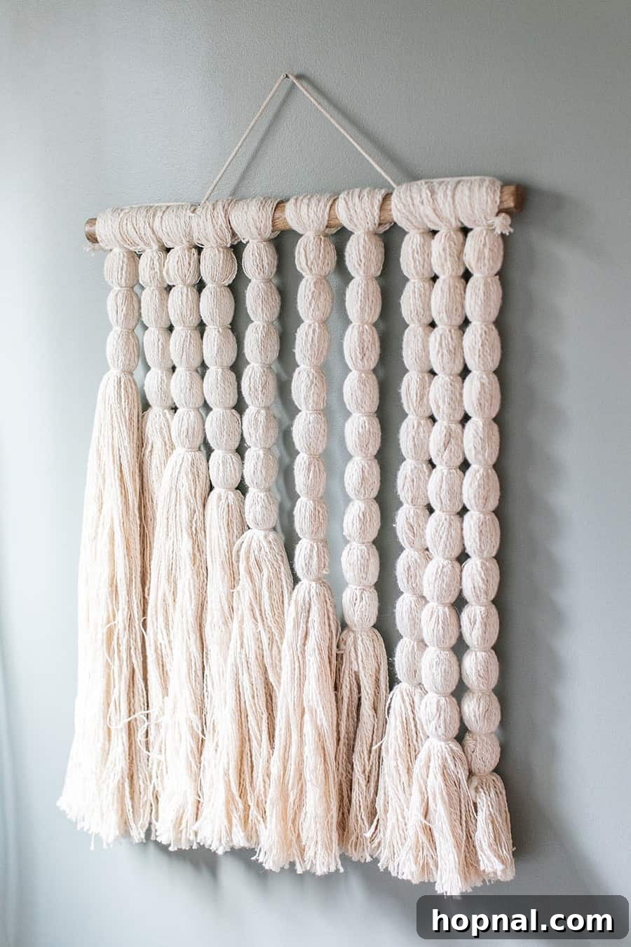 Nature-inspired wall art from Target adds a charming touch to a woodsy kids bedroom, completing the cabin aesthetic.