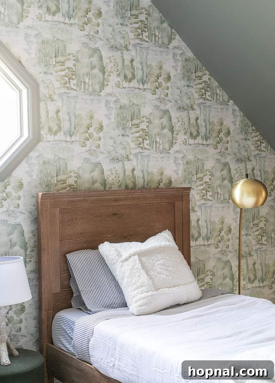 A beautifully designed woodsy kids bedroom, showcasing all the elements for a perfect cabin retreat, from themed decor to comfortable bedding.