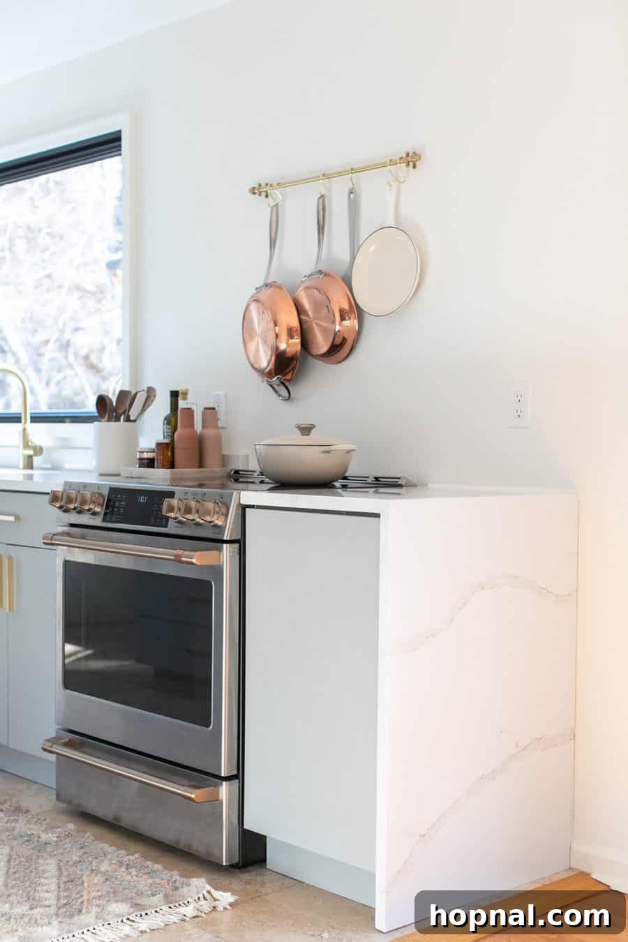 Tiny Kitchen Big Impact 2 Small kitchen remodel with copper pots, cafe appliances in a Tennessee cabin