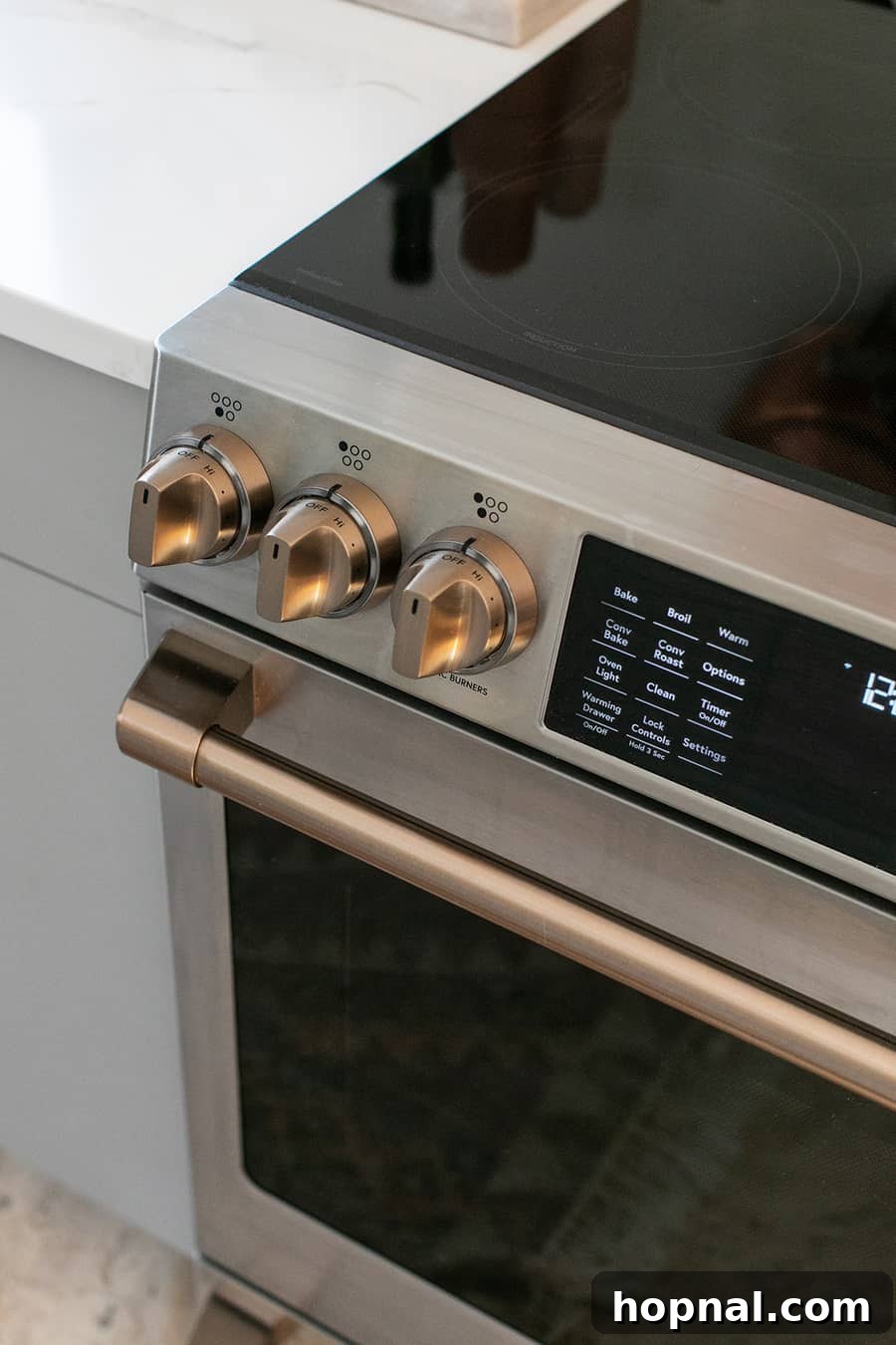 Tiny Kitchen Big Impact 12 Cafe appliance stainless steel convection range with drywall backsplash