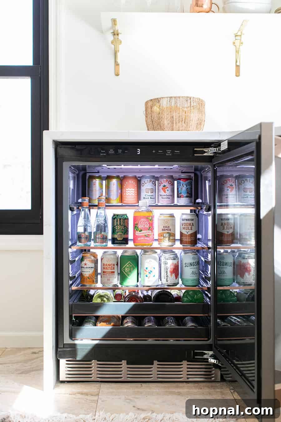 Tiny Kitchen Big Impact 14 Cafe Appliances Beverage center stocked with soda, beer, water and wine