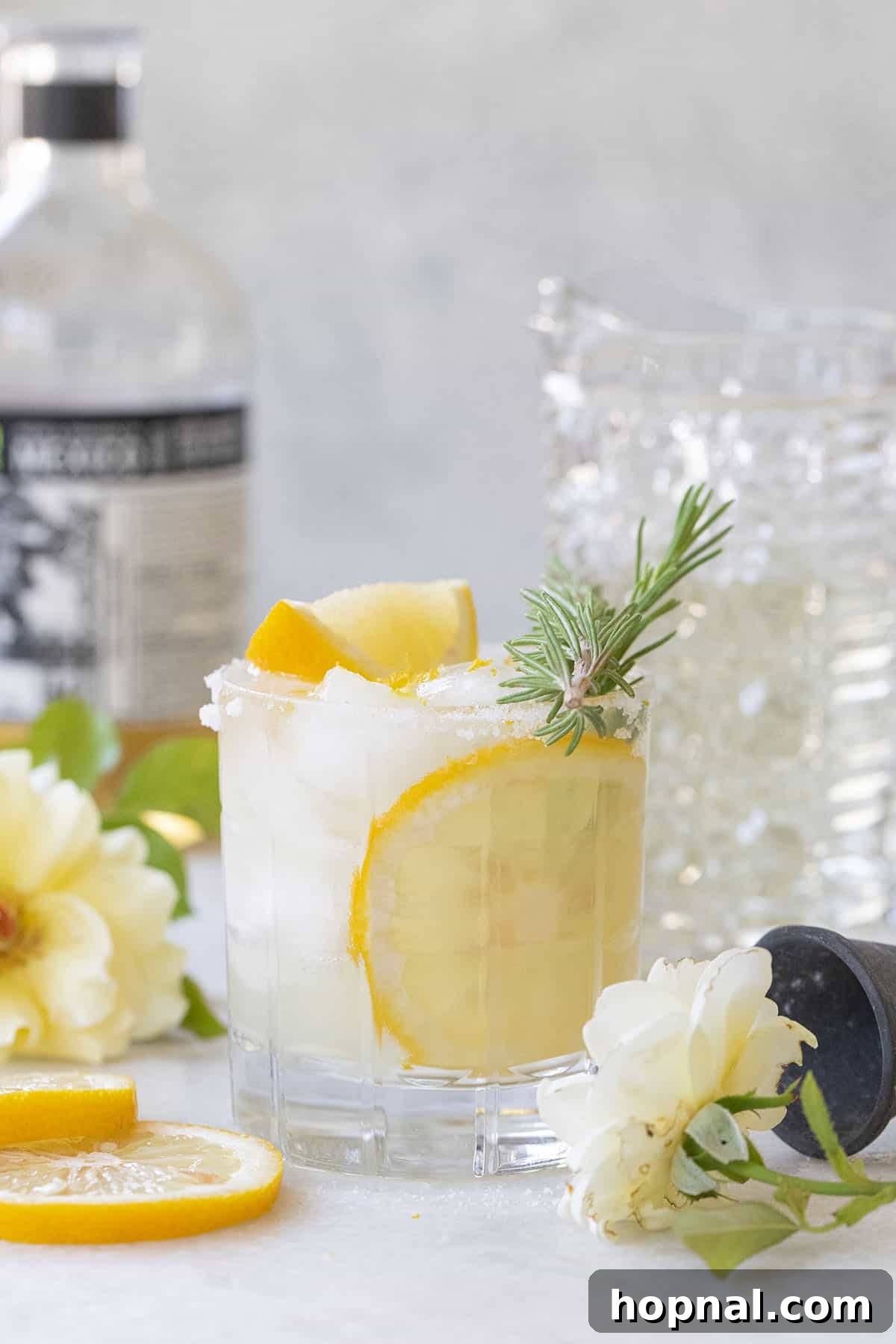 Lemon Margarita with a sugared rim and lemon slice, a tangy and sweet tequila treat.