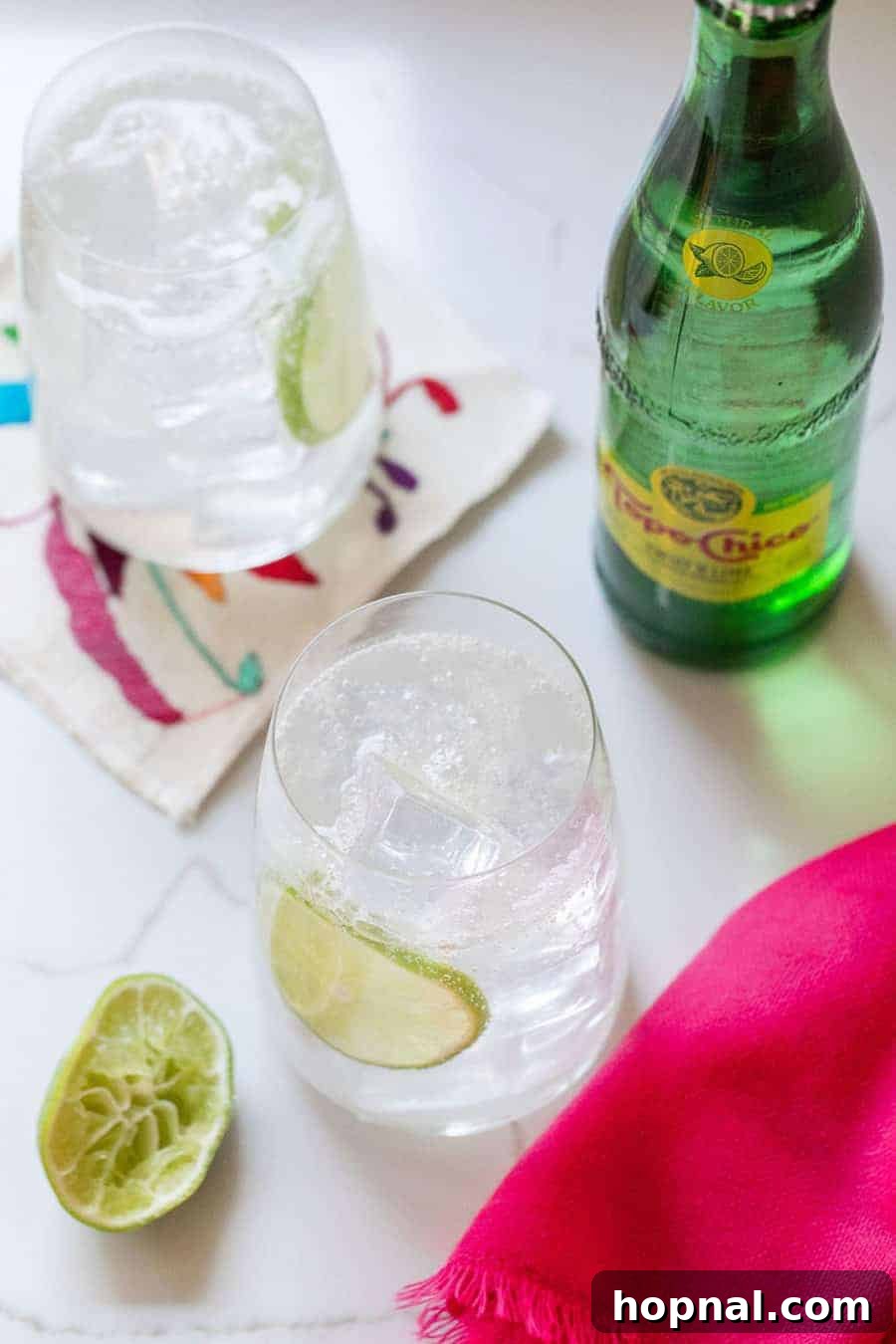 Refreshing Ranch Water cocktail with lime and ice in a tall glass, a perfect low-calorie tequila drink option.